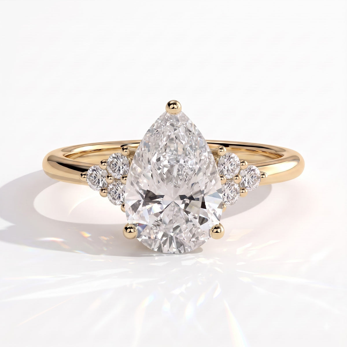 Pear lab-grown diamond halo engagement ring in 14K (585) yellow gold, front view 