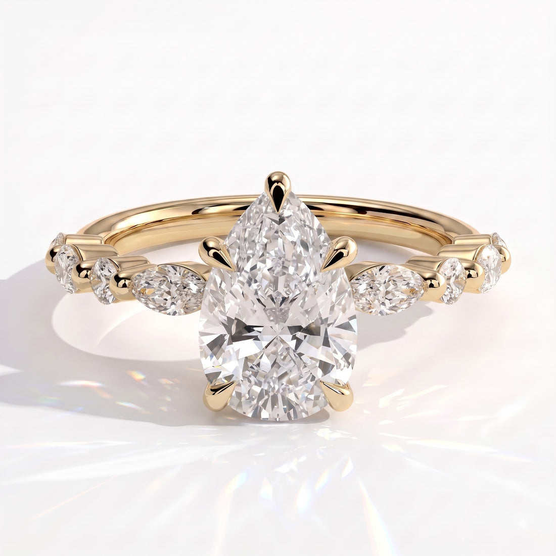 Pear lab-grown diamond halo engagement ring in 14K (585) yellow gold, front view 