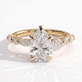 Pear lab-grown diamond halo engagement ring in 14K (585) yellow gold, front view 