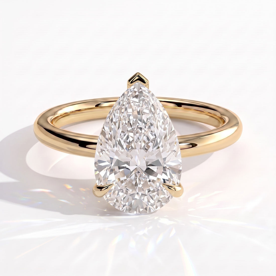 Pear lab-grown diamond solitaire engagement ring in 14K (585) yellow gold, front view 