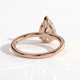 Pear lab-grown diamond solitaire engagement ring in 14K (585) rose gold, on white background 