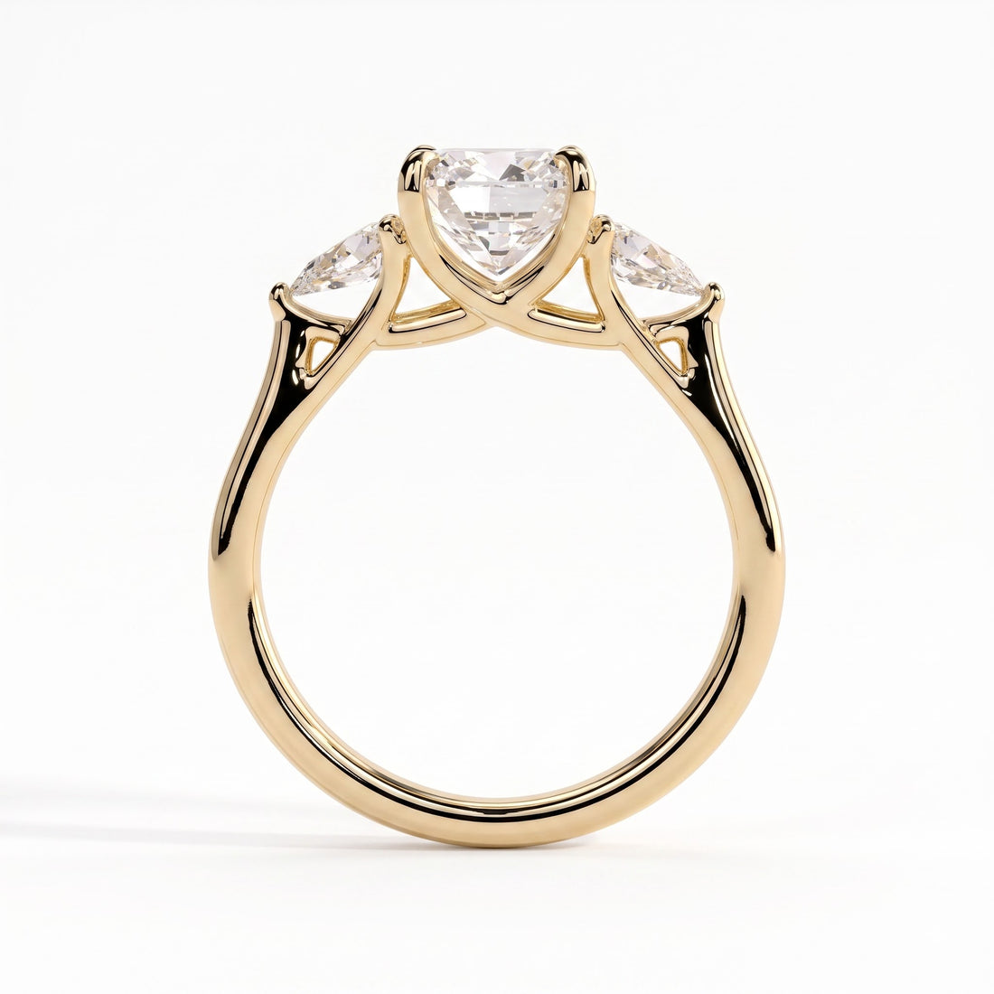 Cushion lab-grown diamond three-stone engagement ring in 14K (585) yellow gold, side profile 