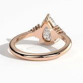 Pear lab-grown diamond halo engagement ring in 18K (750) rose gold, on white background 