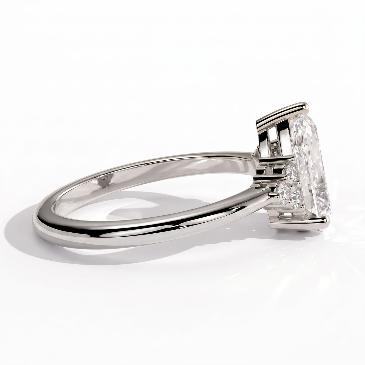 Pear lab-grown diamond halo engagement ring in 18K (750) white gold, on white background 