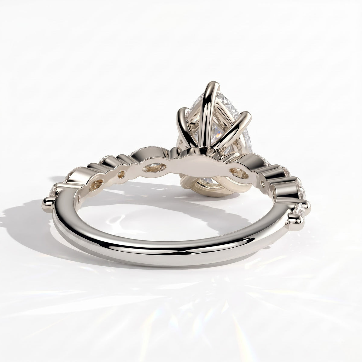 Pear lab-grown diamond halo engagement ring in 18K (750) white gold, on white background 