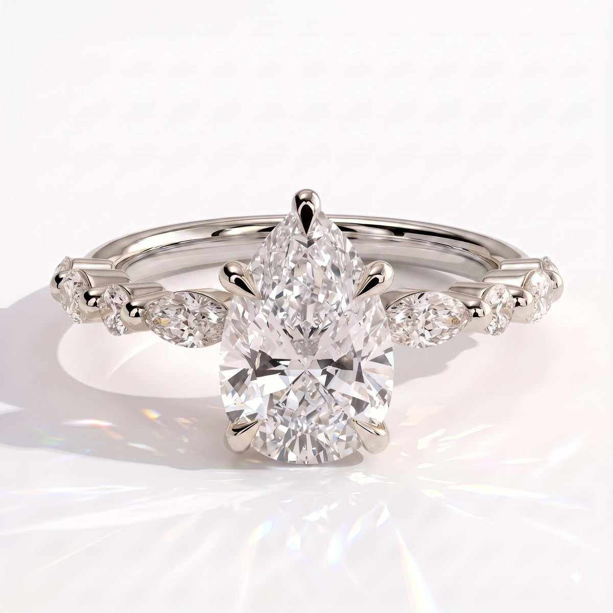 Pear lab-grown diamond halo engagement ring in 18K (750) white gold, front view 