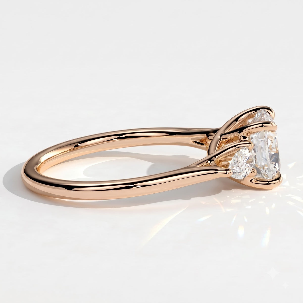 Cushion lab-grown diamond three-stone engagement ring in 18K (750) rose gold, detail view 
