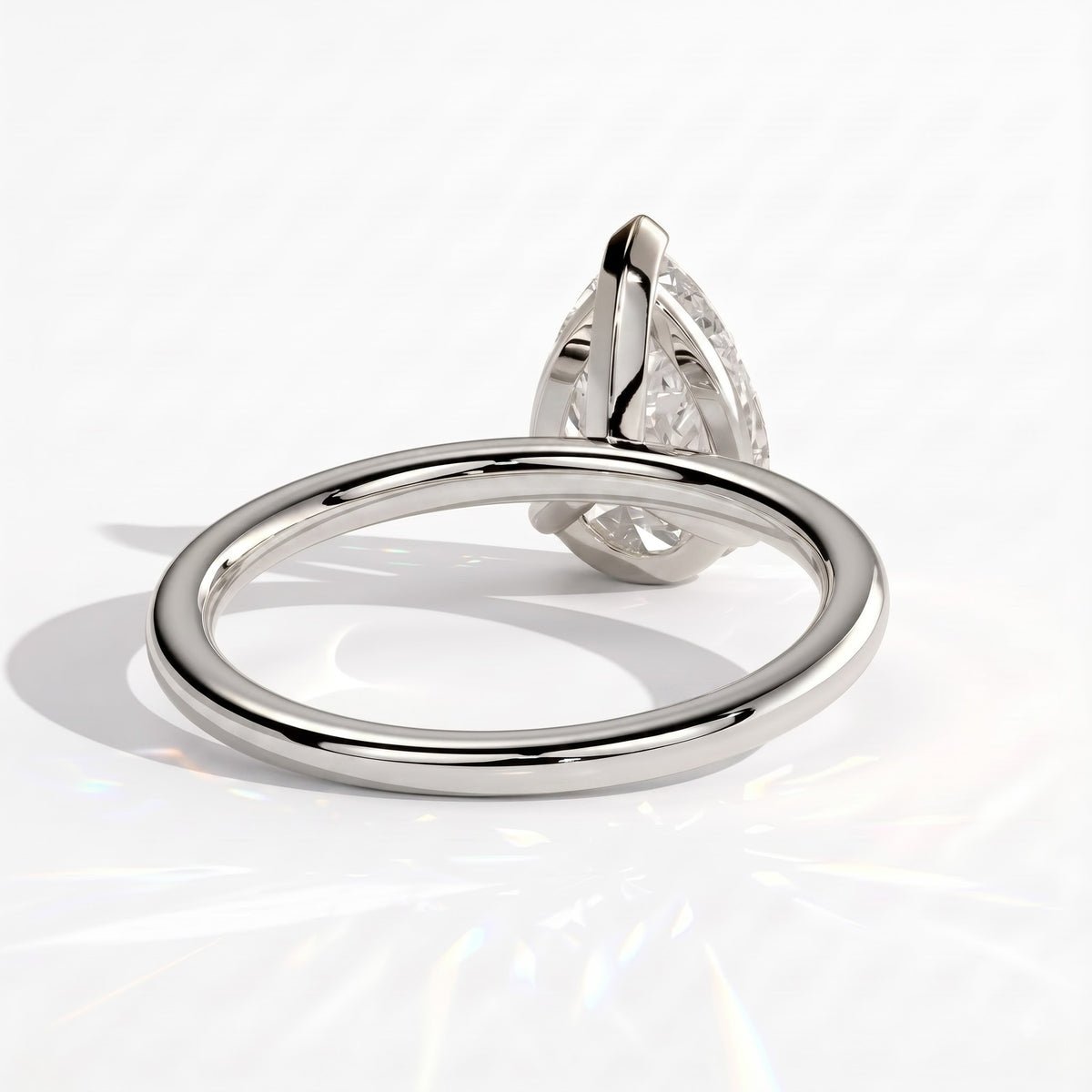 Pear lab-grown diamond solitaire engagement ring in 950 platinum, on white background 