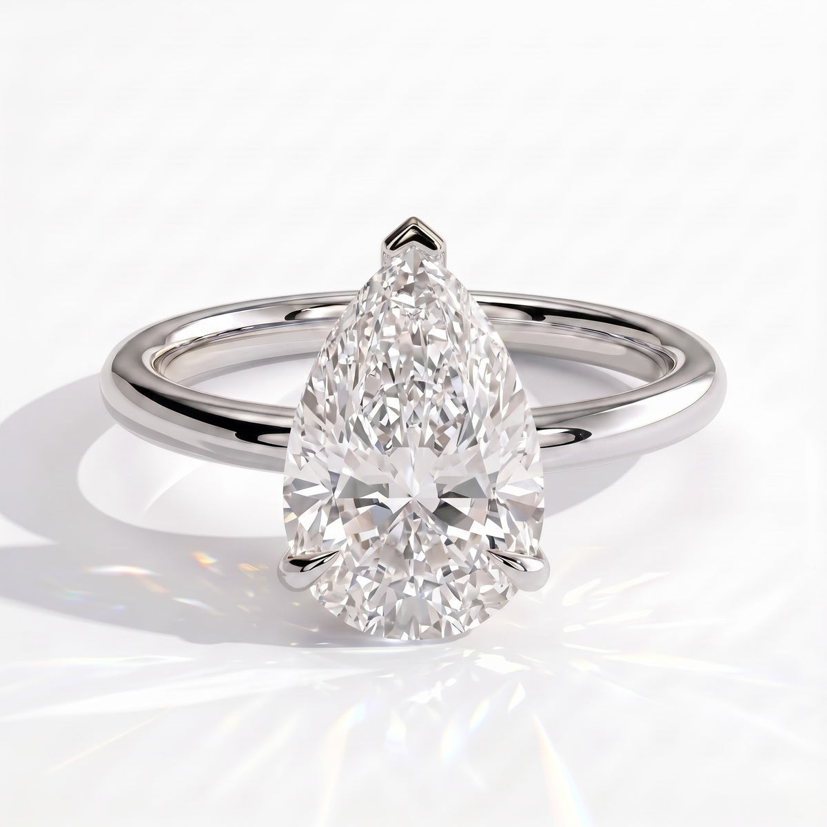 Pear lab-grown diamond solitaire engagement ring in 950 platinum, front view 