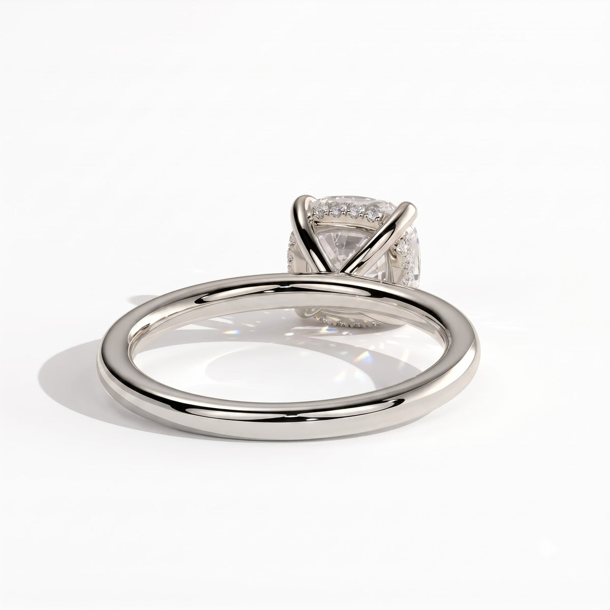 Cushion lab-grown diamond solitaire engagement ring in 14K (585) white gold, on white background 