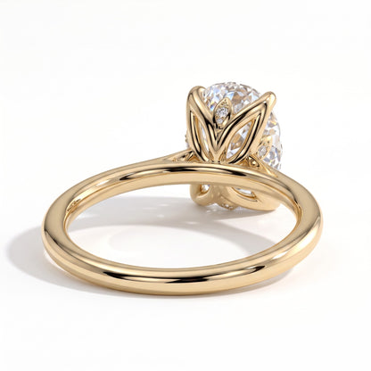 Elongated Cushion lab-grown diamond solitaire engagement ring in 14K (585) yellow gold, on white background 