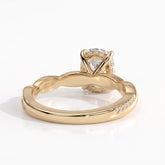 Elongated Cushion lab-grown diamond halo engagement ring in 14K (585) yellow gold, on white background 