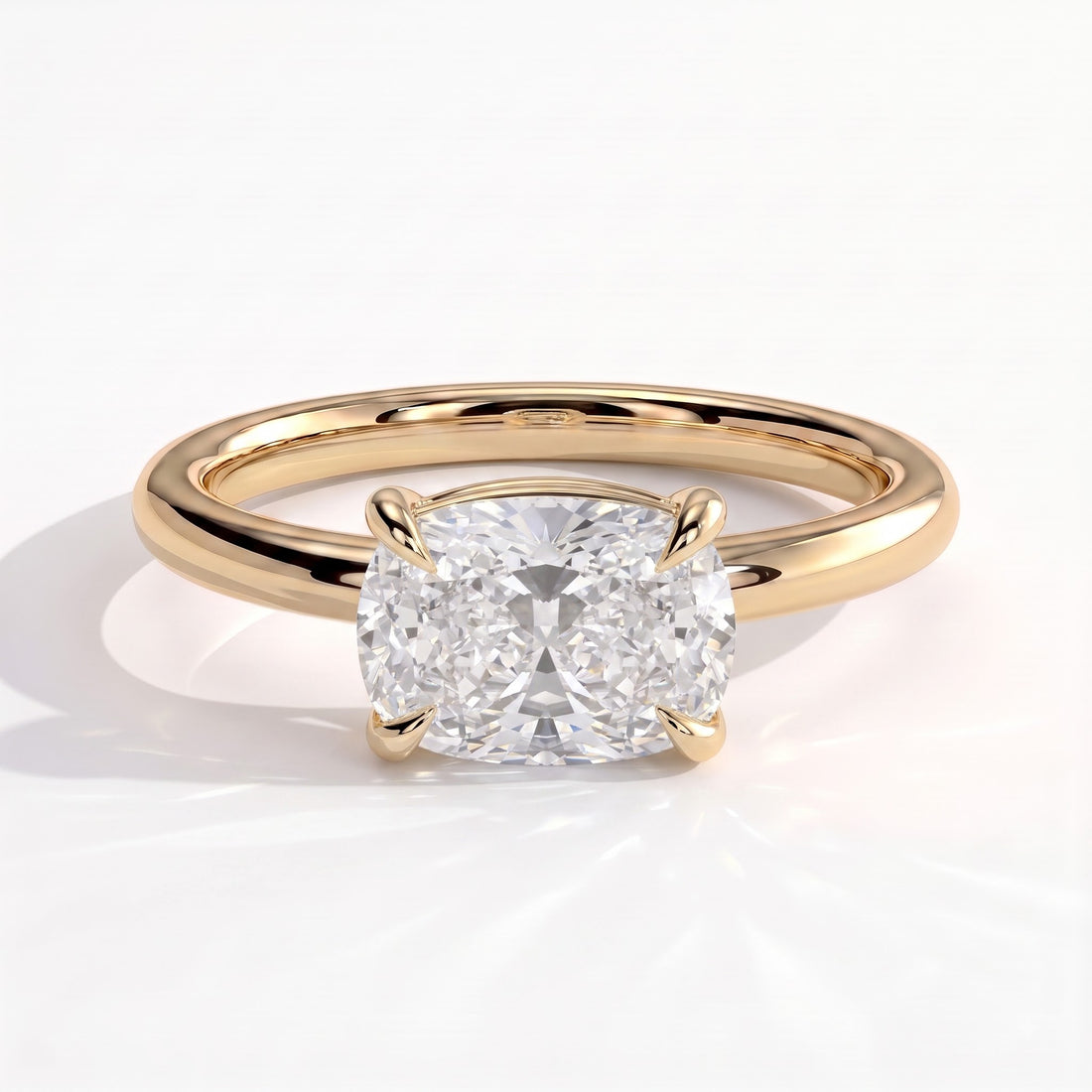 Elongated Cushion lab-grown diamond east-west solitaire engagement ring in 14K (585) yellow gold, front view 