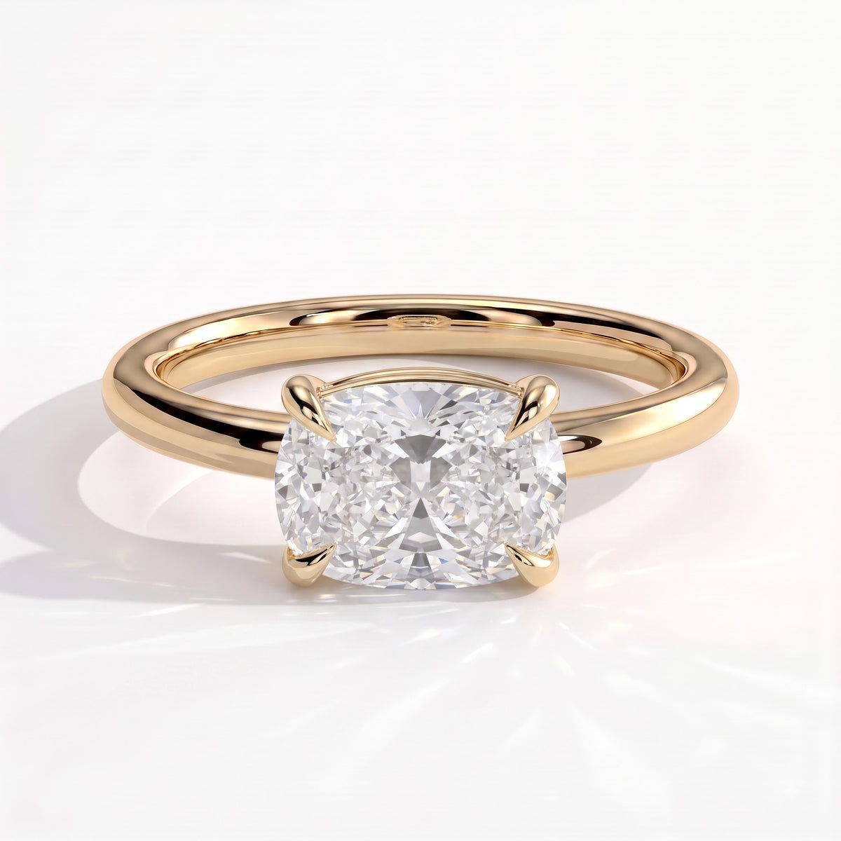 Elongated Cushion lab-grown diamond east-west solitaire engagement ring in 14K (585) yellow gold, front view 