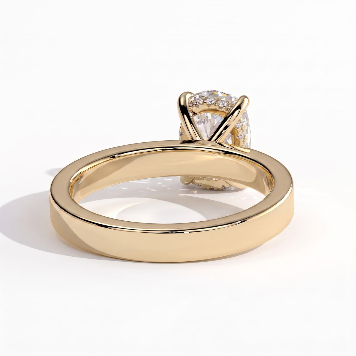 Elongated Cushion lab-grown diamond solitaire engagement ring in 14K (585) yellow gold, on white background 