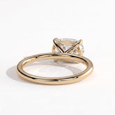 Elongated Cushion lab-grown diamond east-west solitaire engagement ring in 18K (750) yellow gold, on white background 