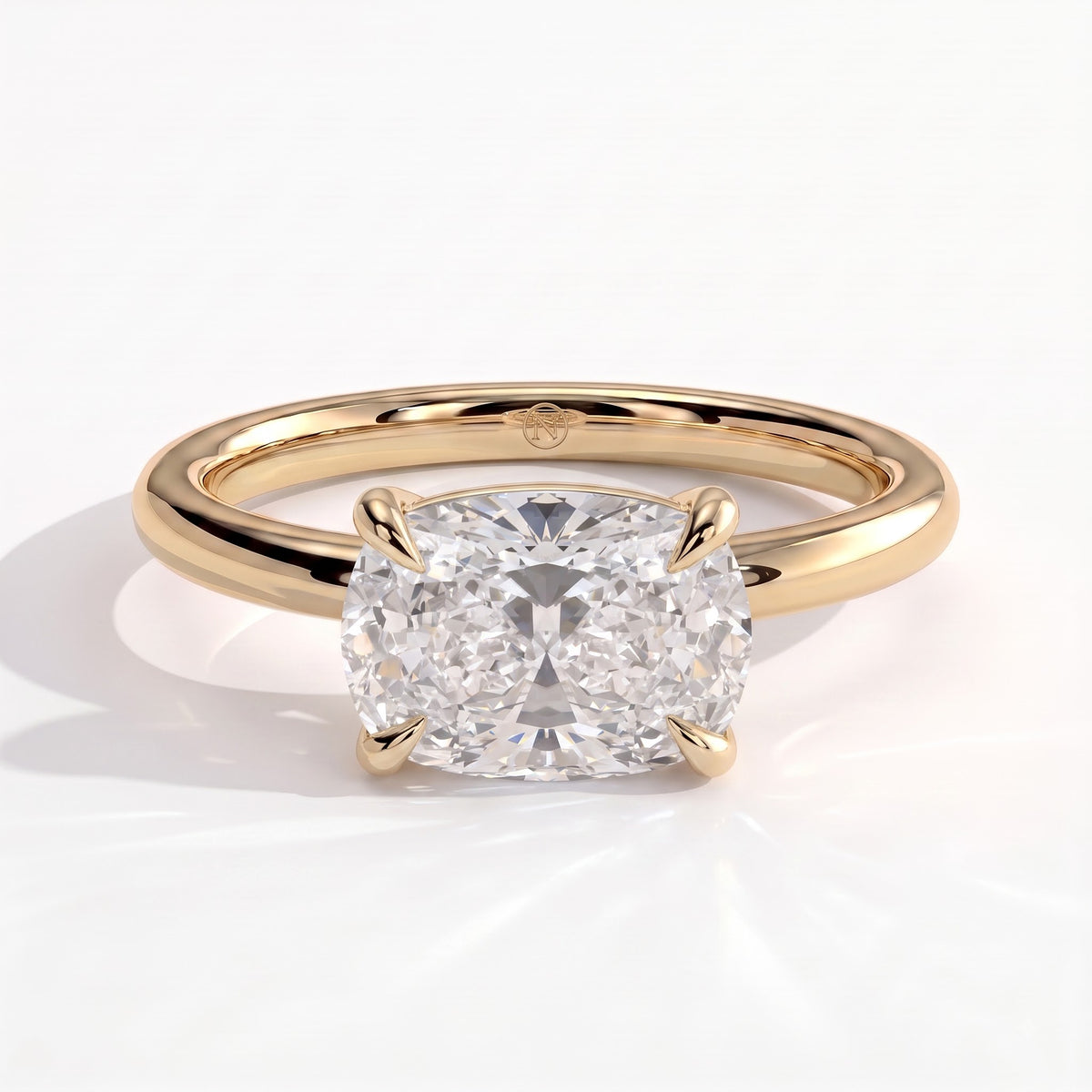 Elongated Cushion lab-grown diamond east-west solitaire engagement ring in 18K (750) yellow gold, front view 