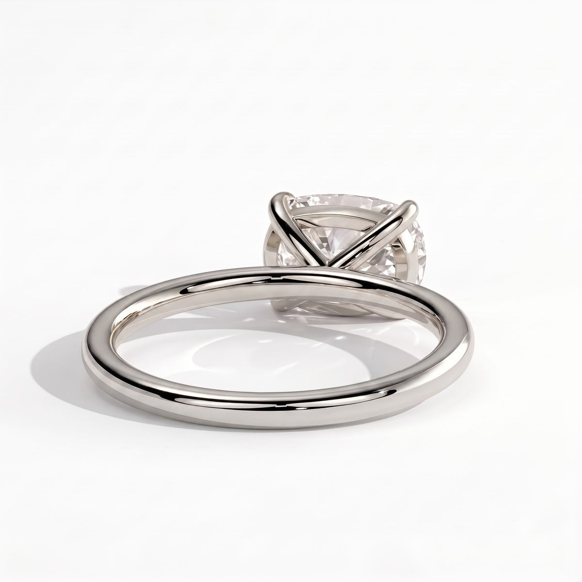 Elongated Cushion lab-grown diamond east-west solitaire engagement ring in 950 platinum, on white background 