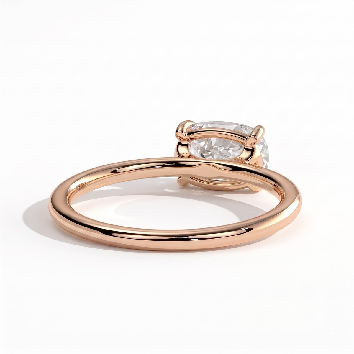 Elongated Cushion lab-grown diamond east-west solitaire engagement ring in 18K (750) rose gold, on white background 