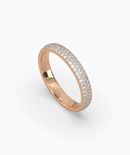 Celine round lab-grown diamond pavé eternity ring in 750 rose gold, angled view 