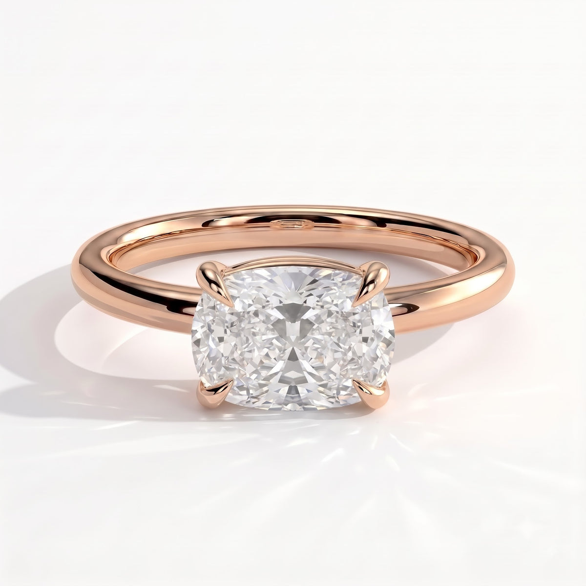 Elongated Cushion lab-grown diamond east-west solitaire engagement ring in 18K (750) rose gold, front view 