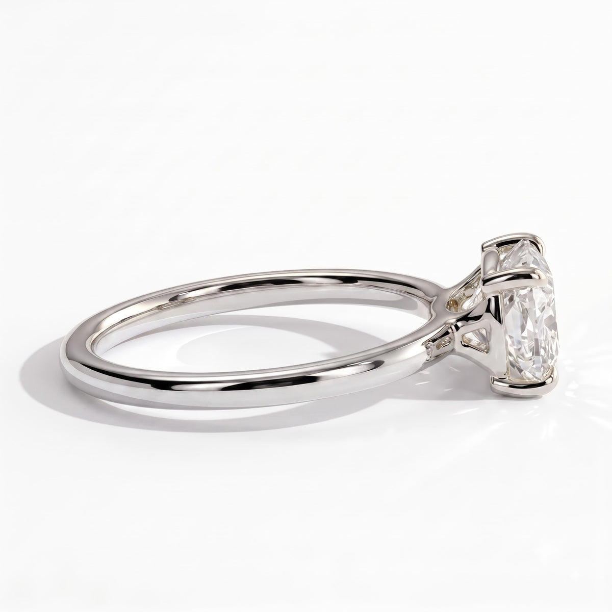 Elongated Cushion lab-grown diamond east-west solitaire engagement ring in 950 platinum, detail view 