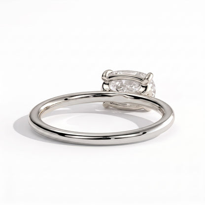 Elongated Cushion lab-grown diamond east-west solitaire engagement ring in 950 platinum, on white background 