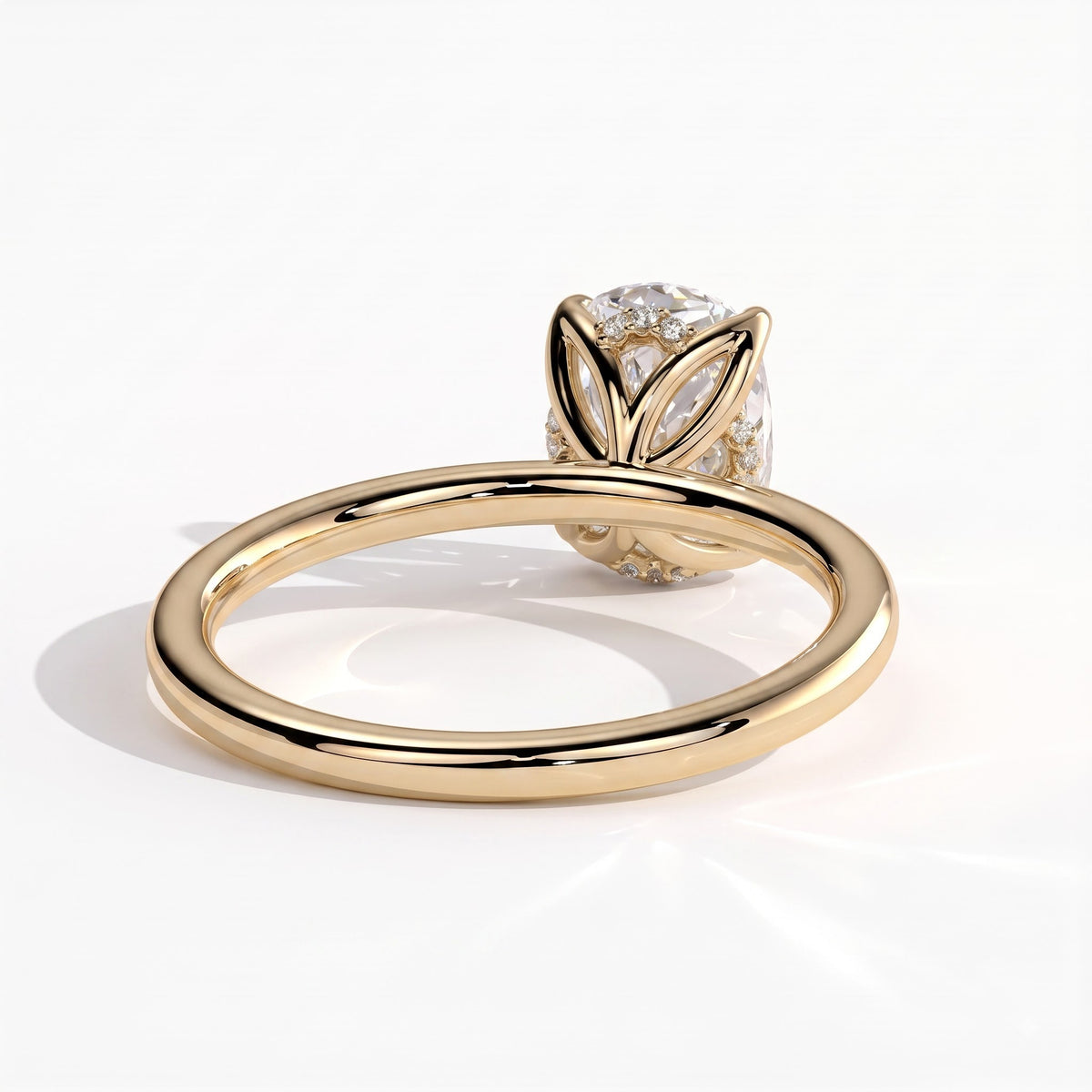Elongated Cushion lab-grown diamond solitaire engagement ring in 14K (585) yellow gold, on white background 