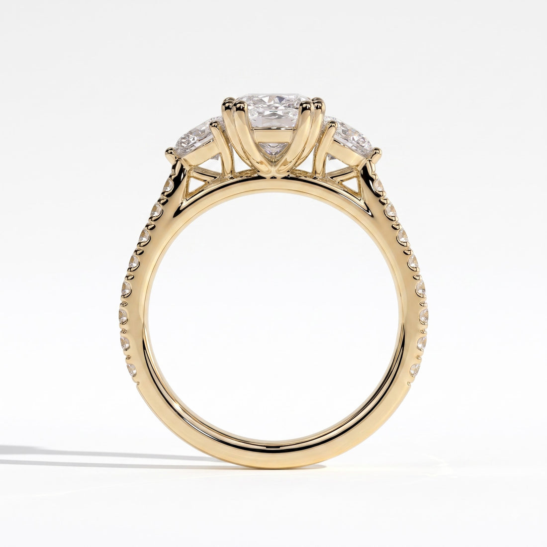 Elongated Cushion lab-grown diamond three-stone engagement ring in 14K (585) yellow gold, side profile 