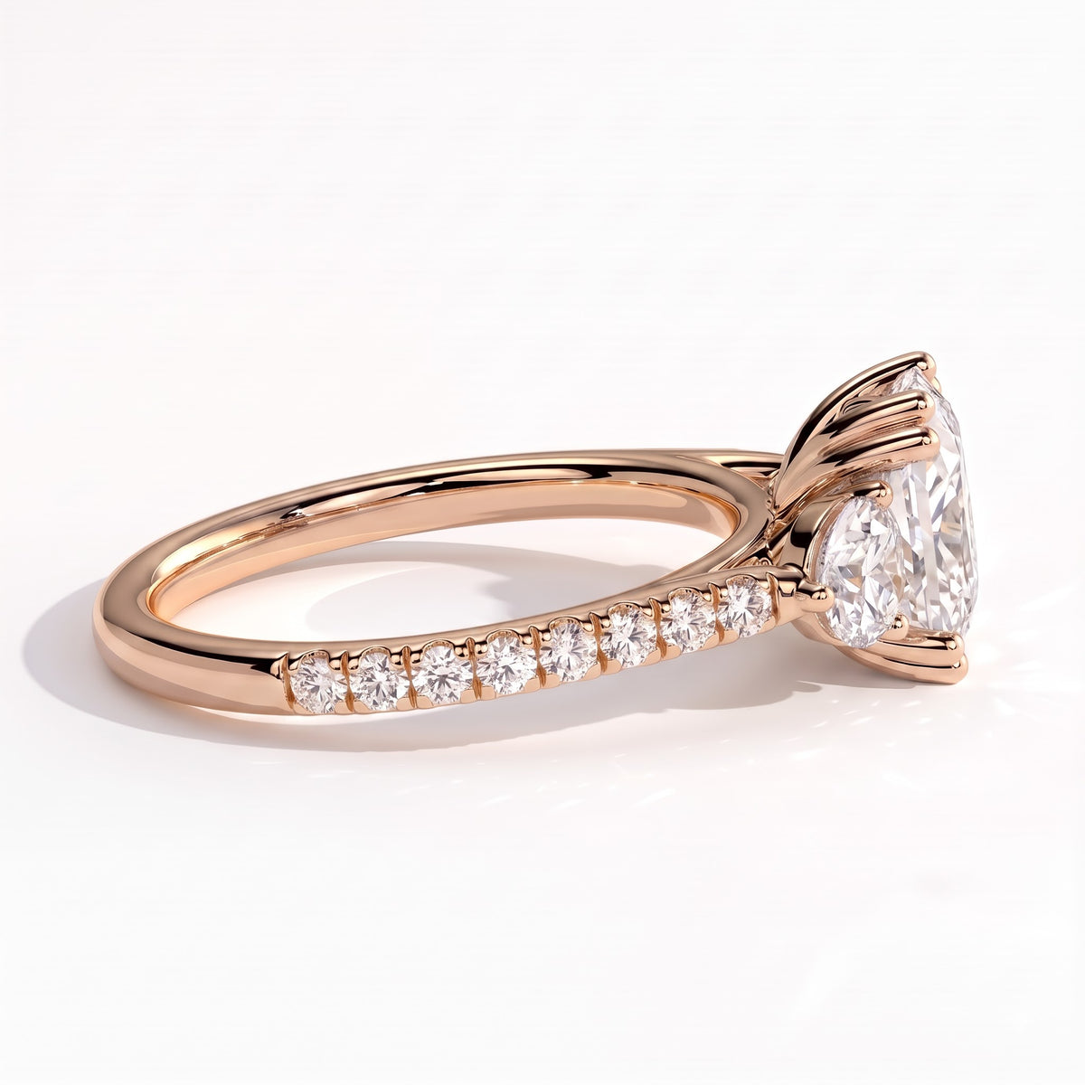 Elongated Cushion lab-grown diamond three-stone engagement ring in 14K (585) rose gold, detail view 