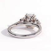 Elongated Cushion lab-grown diamond three-stone engagement ring in 14K (585) white gold, on white background 