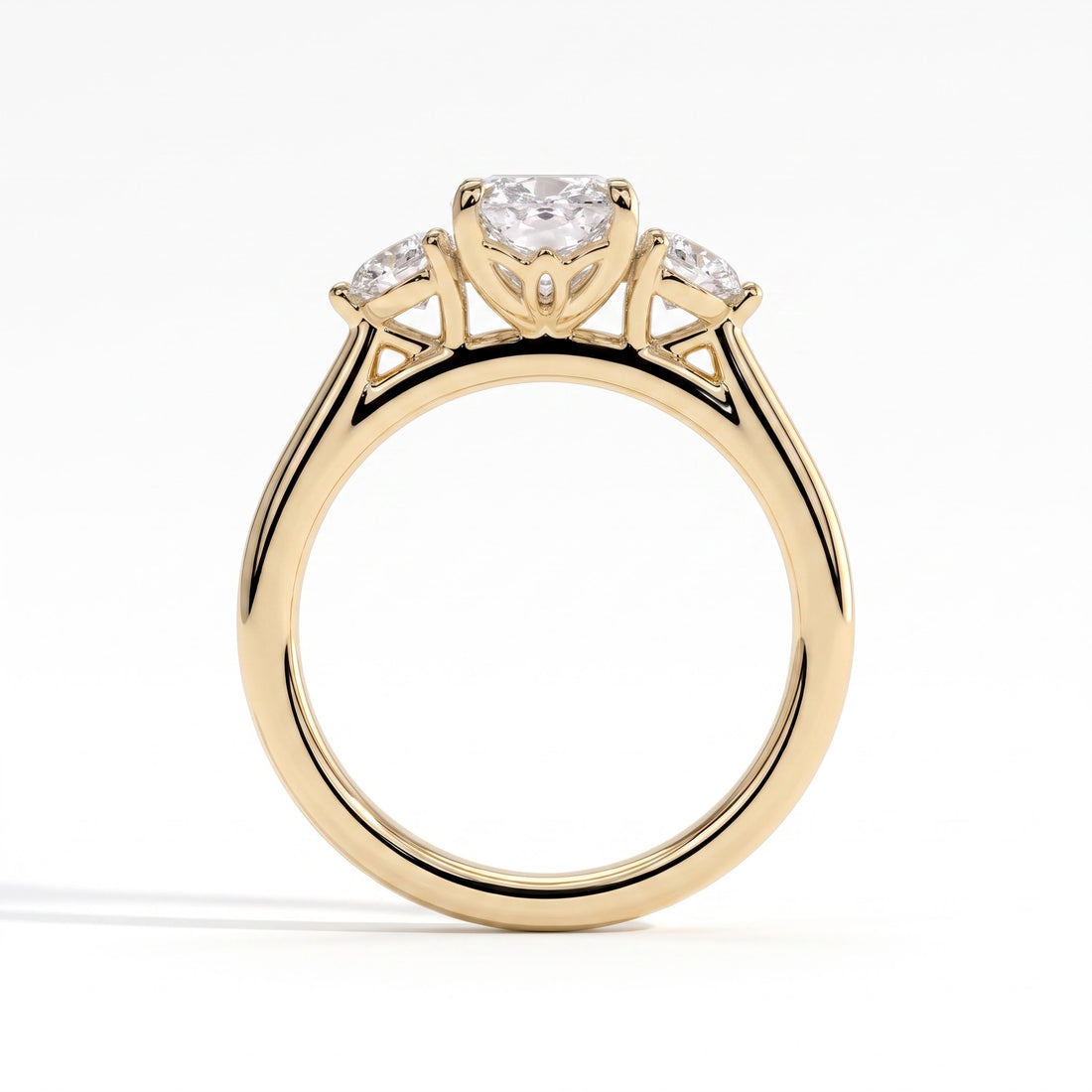 Elongated Cushion lab-grown diamond three-stone engagement ring in 14K (585) yellow gold, side profile 