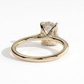 Elongated Cushion lab-grown diamond halo engagement ring in 14K (585) yellow gold, on white background 