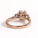 Elongated Cushion lab-grown diamond three-stone engagement ring in 18K (750) rose gold, on white background 
