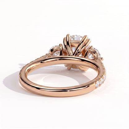 Elongated Cushion lab-grown diamond three-stone engagement ring in 18K (750) rose gold, on white background 