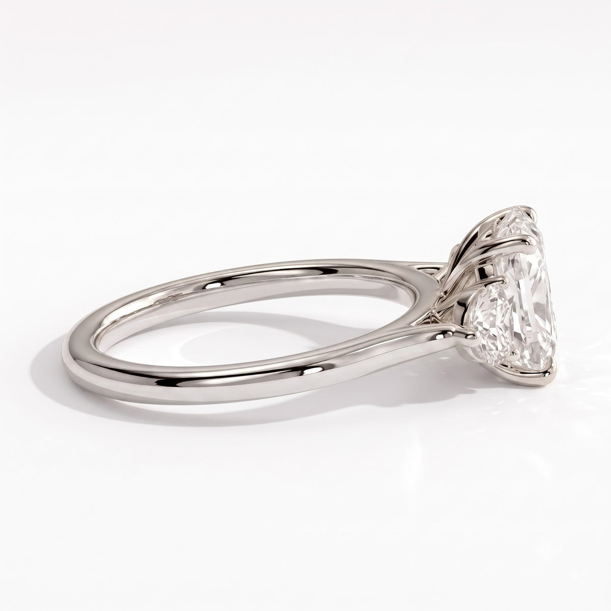 Elongated Cushion lab-grown diamond three-stone engagement ring in 18K (750) white gold, detail view 