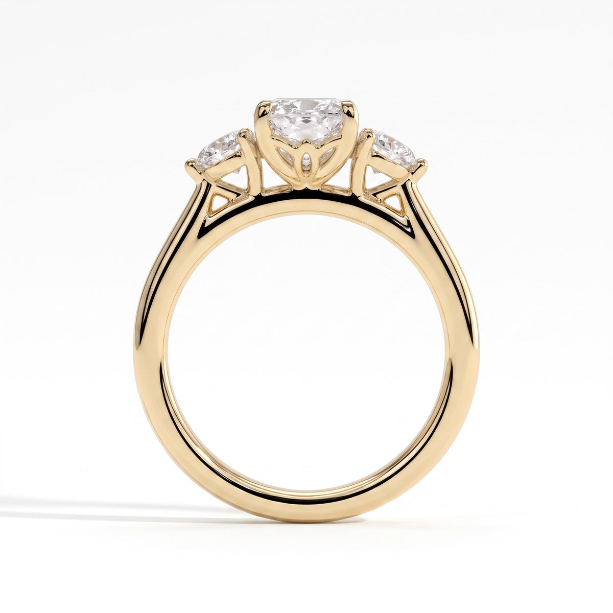 Elongated Cushion lab-grown diamond three-stone engagement ring in 18K (750) yellow gold, side profile 