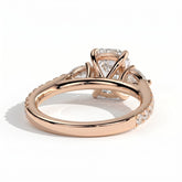 Elongated Cushion lab-grown diamond three-stone engagement ring in 18K (750) rose gold, on white background 