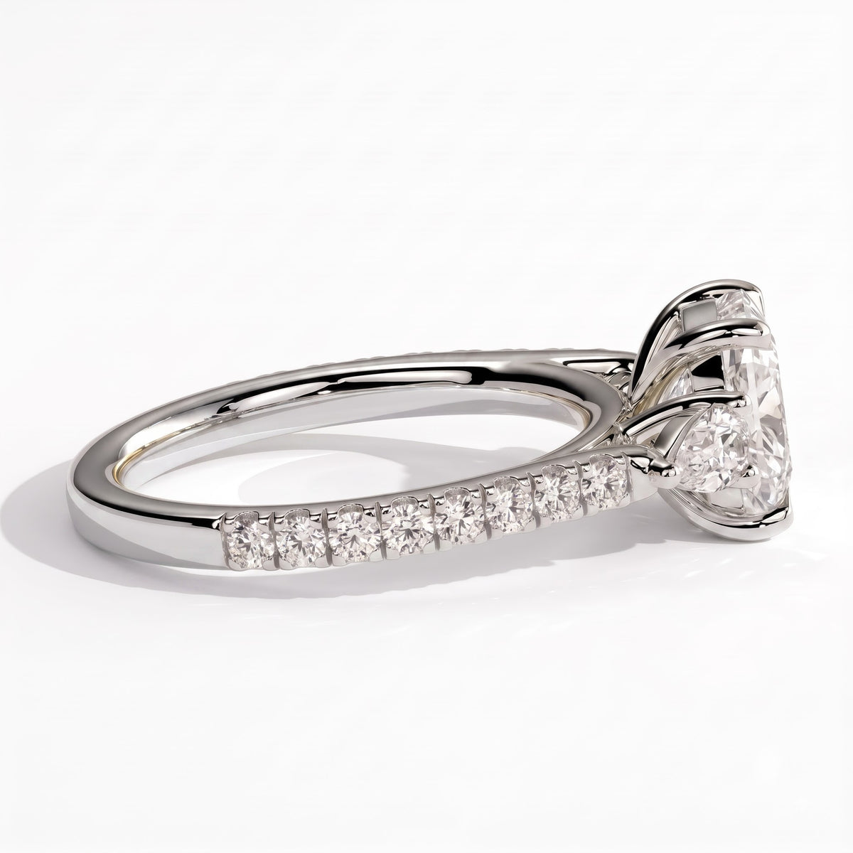Elongated Cushion lab-grown diamond three-stone engagement ring in 950 platinum, detail view 