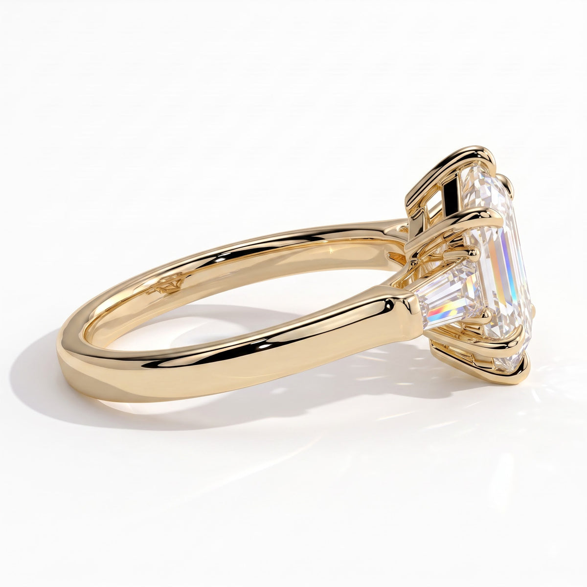 Elongated Hexagon lab-grown diamond three-stone engagement ring in 14K (585) yellow gold, detail view 