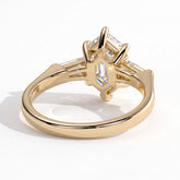 Elongated Hexagon lab-grown diamond three-stone engagement ring in 14K (585) yellow gold, on white background 