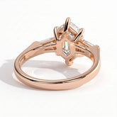 Elongated Hexagon lab-grown diamond three-stone engagement ring in 14K (585) rose gold, on white background 