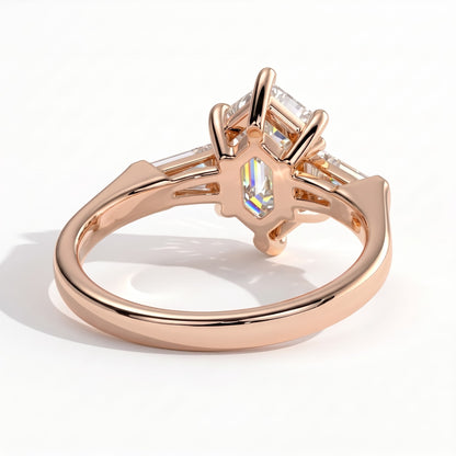 Elongated Hexagon lab-grown diamond three-stone engagement ring in 14K (585) rose gold, on white background 