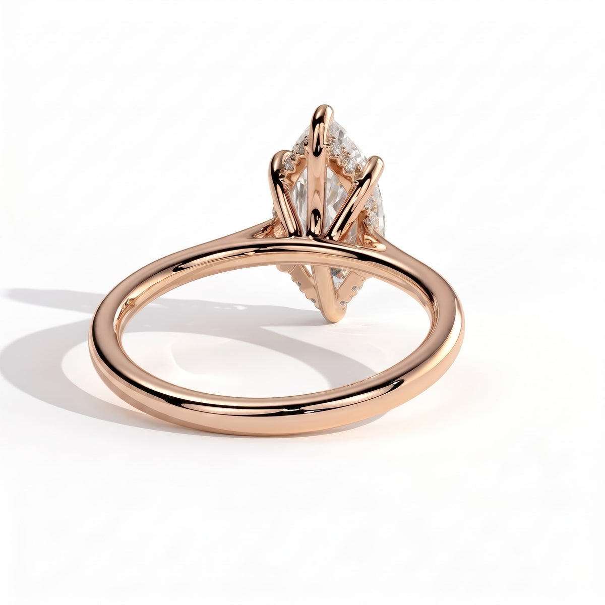 Marquise lab-grown diamond halo engagement ring in 14K (585) rose gold, on white background 