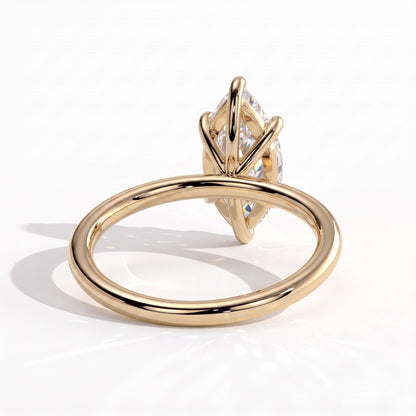 Marquise lab-grown diamond solitaire engagement ring in 14K (585) yellow gold, on white background 