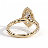 Marquise lab-grown diamond halo engagement ring in 14K (585) yellow gold, on white background 