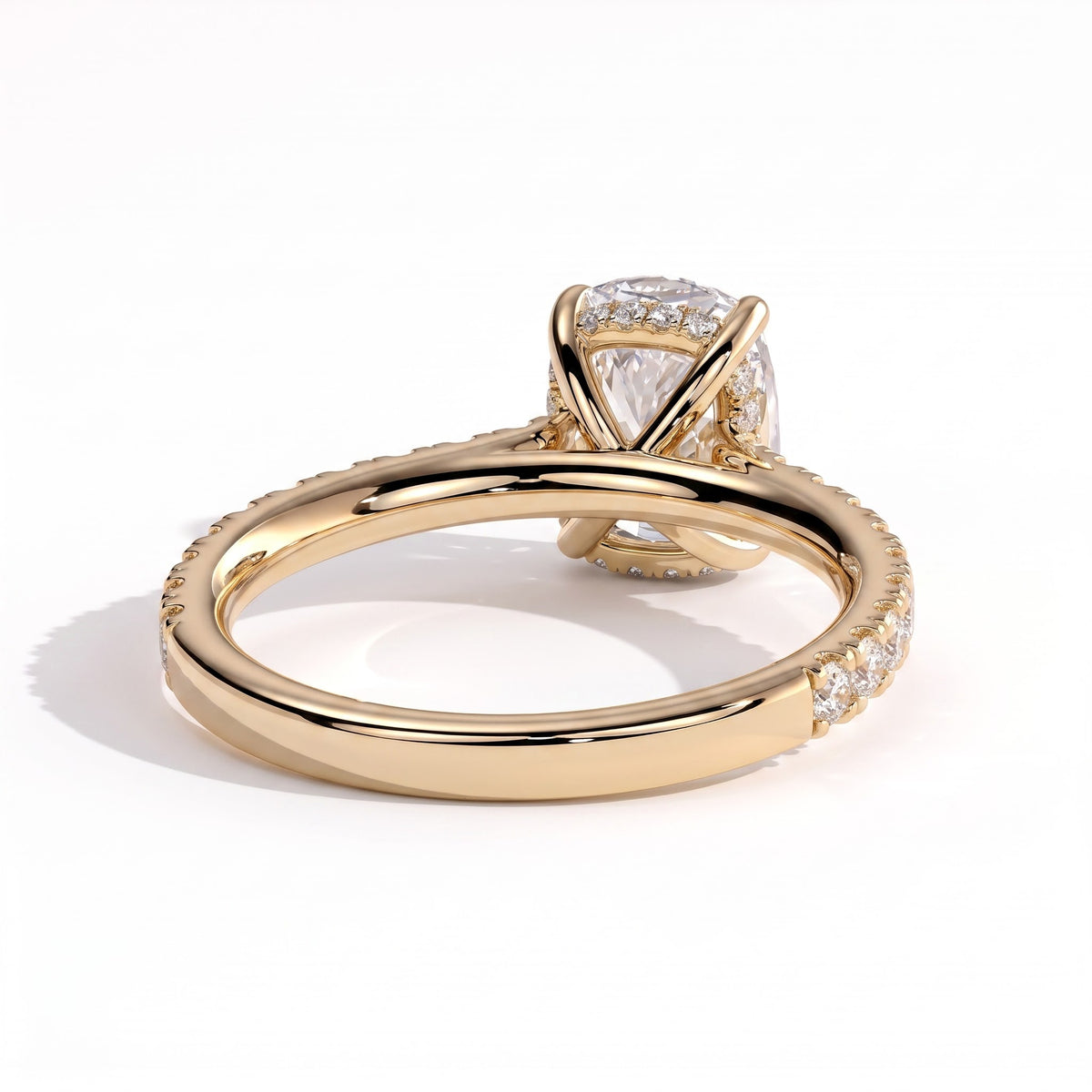 Elongated Cushion lab-grown diamond halo engagement ring in 18K (750) yellow gold, on white background 