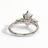 Elongated Hexagon lab-grown diamond three-stone engagement ring in 18K (750) white gold, on white background 