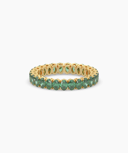 Helene round green gemstone eternity ring in 750 yellow gold, front view 