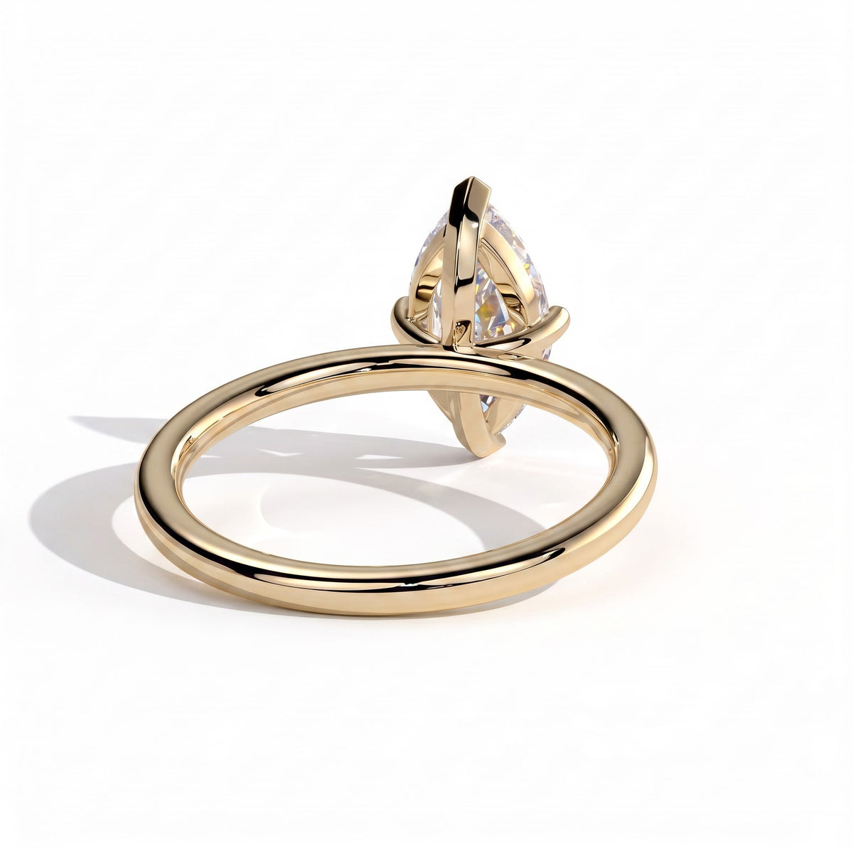 Marquise lab-grown diamond solitaire engagement ring in 18K (750) yellow gold, on white background 